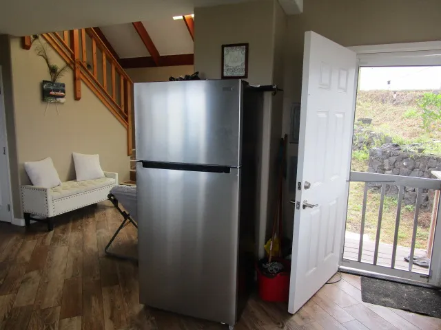 a view of a livingroom with furniture and a window