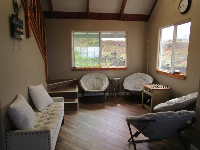 a living room with furniture and a window