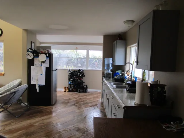 a kitchen with a sink appliances and cabinets