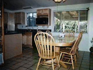1870 West Saxony Road Tucson, AZ 85713 - Photo 4 of 5 a dining room with furniture and a floor to ceiling window
