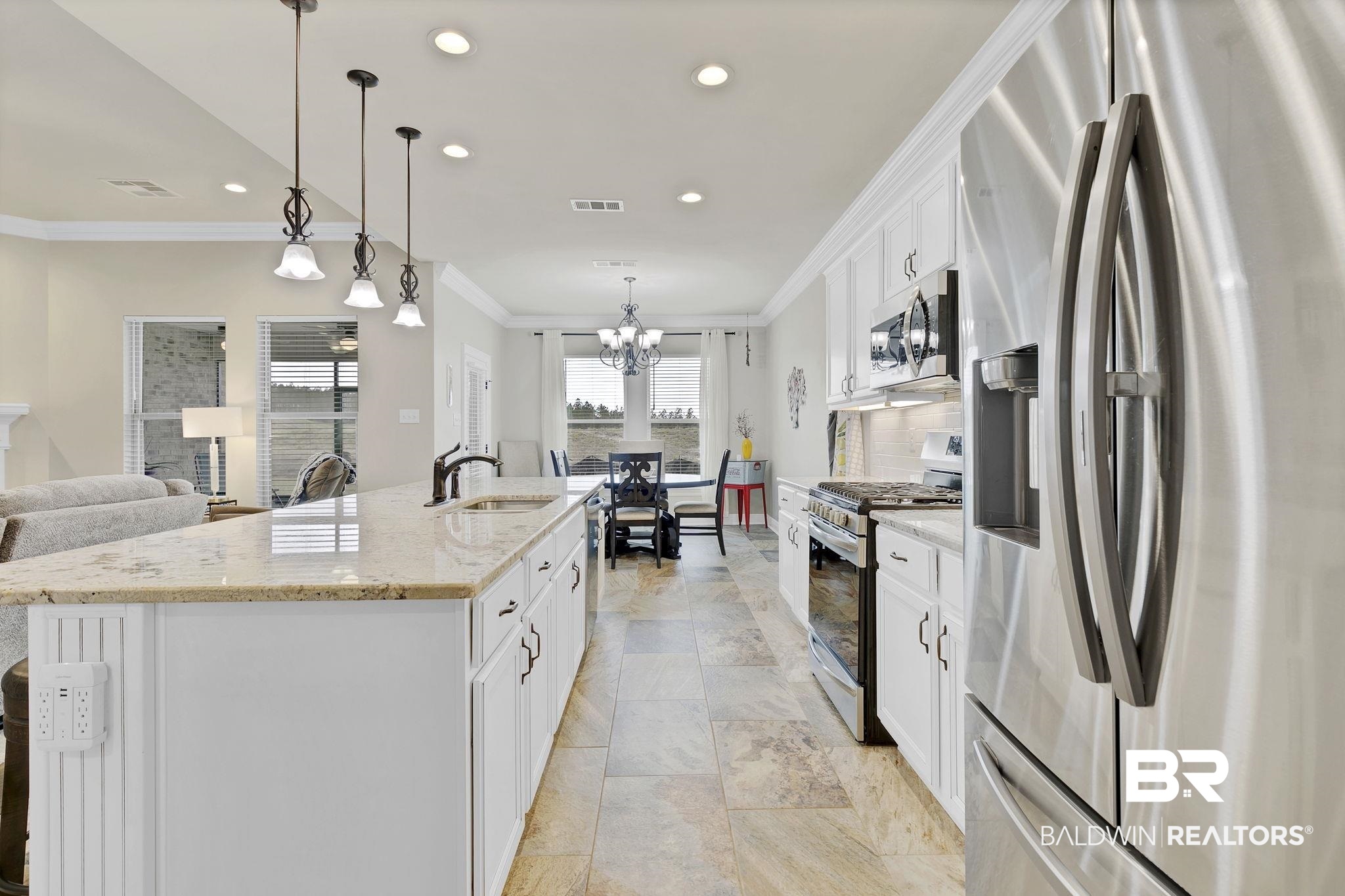 11247 Thistledown Loop Spanish Fort, AL 36527 - Photo 16 of 72 Kitchen with stainless steel appliances, tasteful backsplash, visible vents, ornamental molding, and a sink