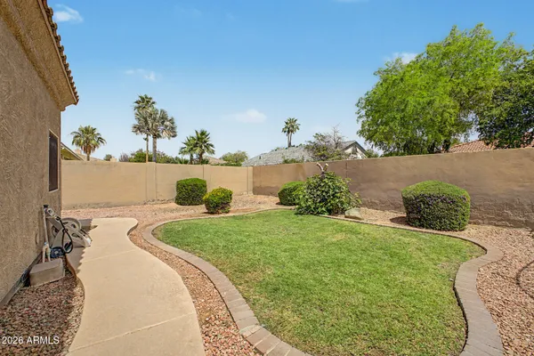 a house view with a sitting space and garden space