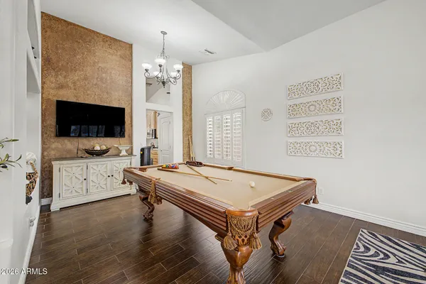 a room with pool table and flat screen tv