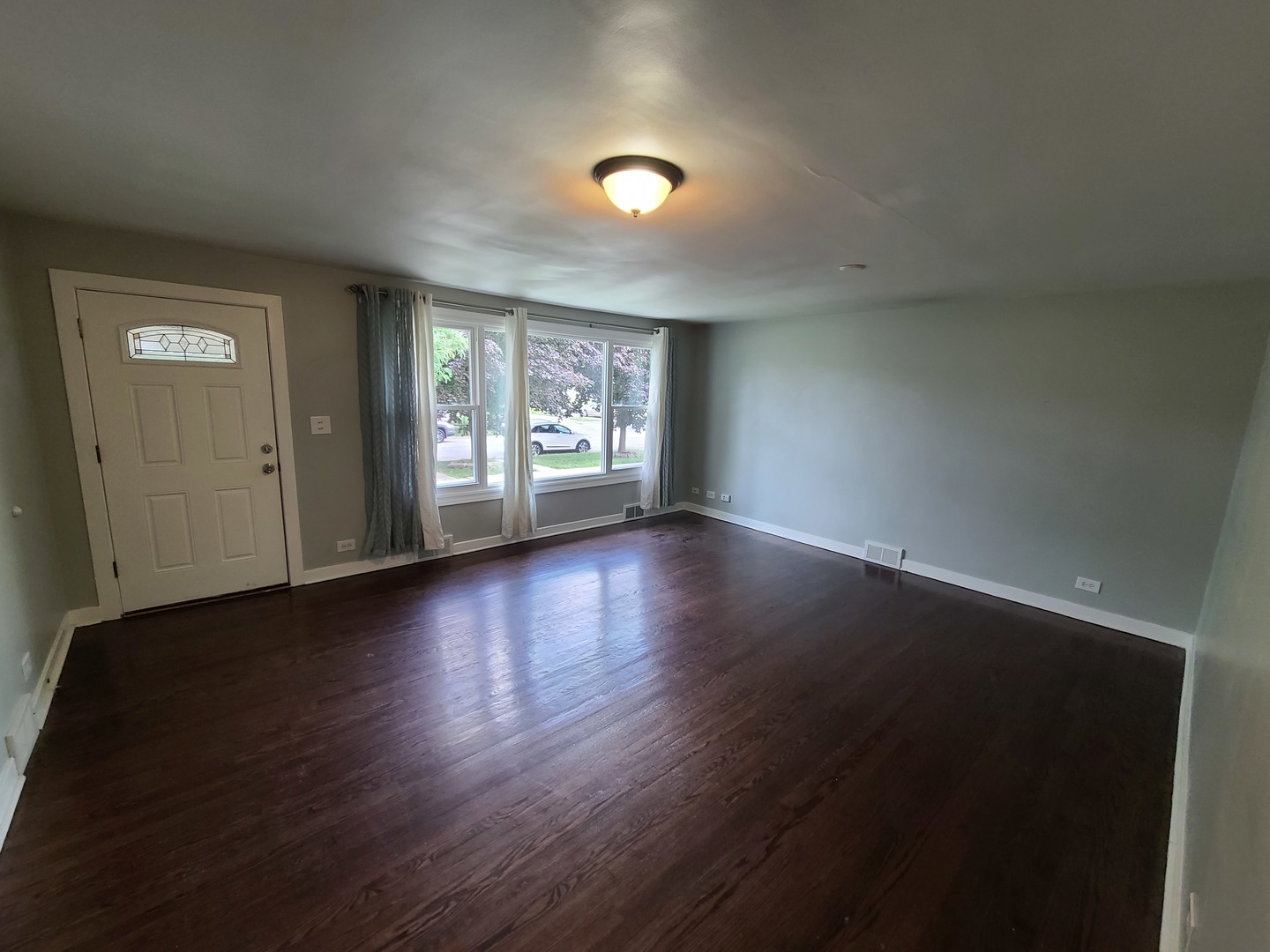 11032 Major Avenue Chicago Ridge, IL 60415 - Photo 2 of 10 an empty room with wooden floor and windows