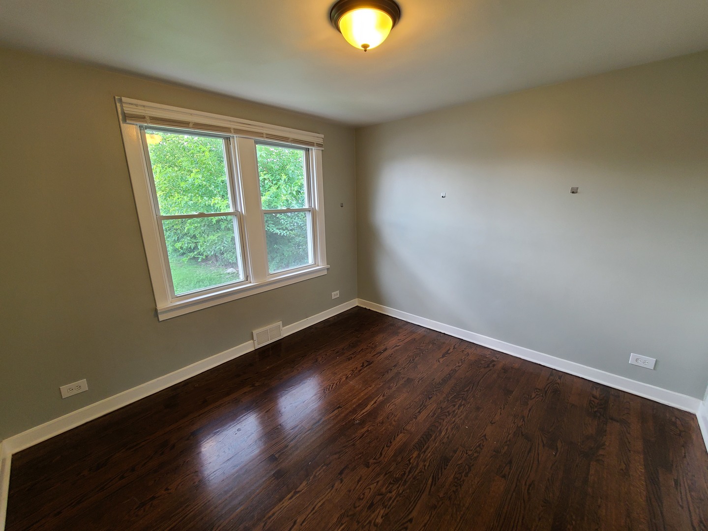 11032 Major Avenue Chicago Ridge, IL 60415 - Photo 7 of 10 a view of an empty room with wooden floor and a window