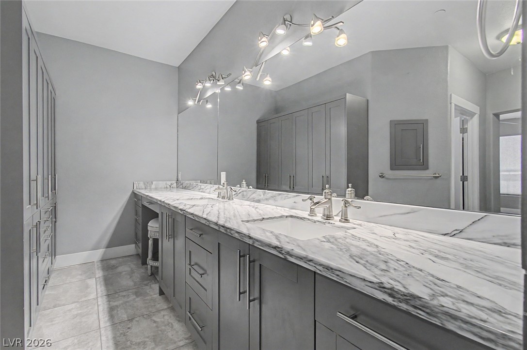 2555 Hampton Road, Unit 6308 Henderson, NV 89052 - Photo 10 of 30 Marble-topped double vanity with make-up counter, abundant cabinetry provides a luxurious and functional bathroom retreat.