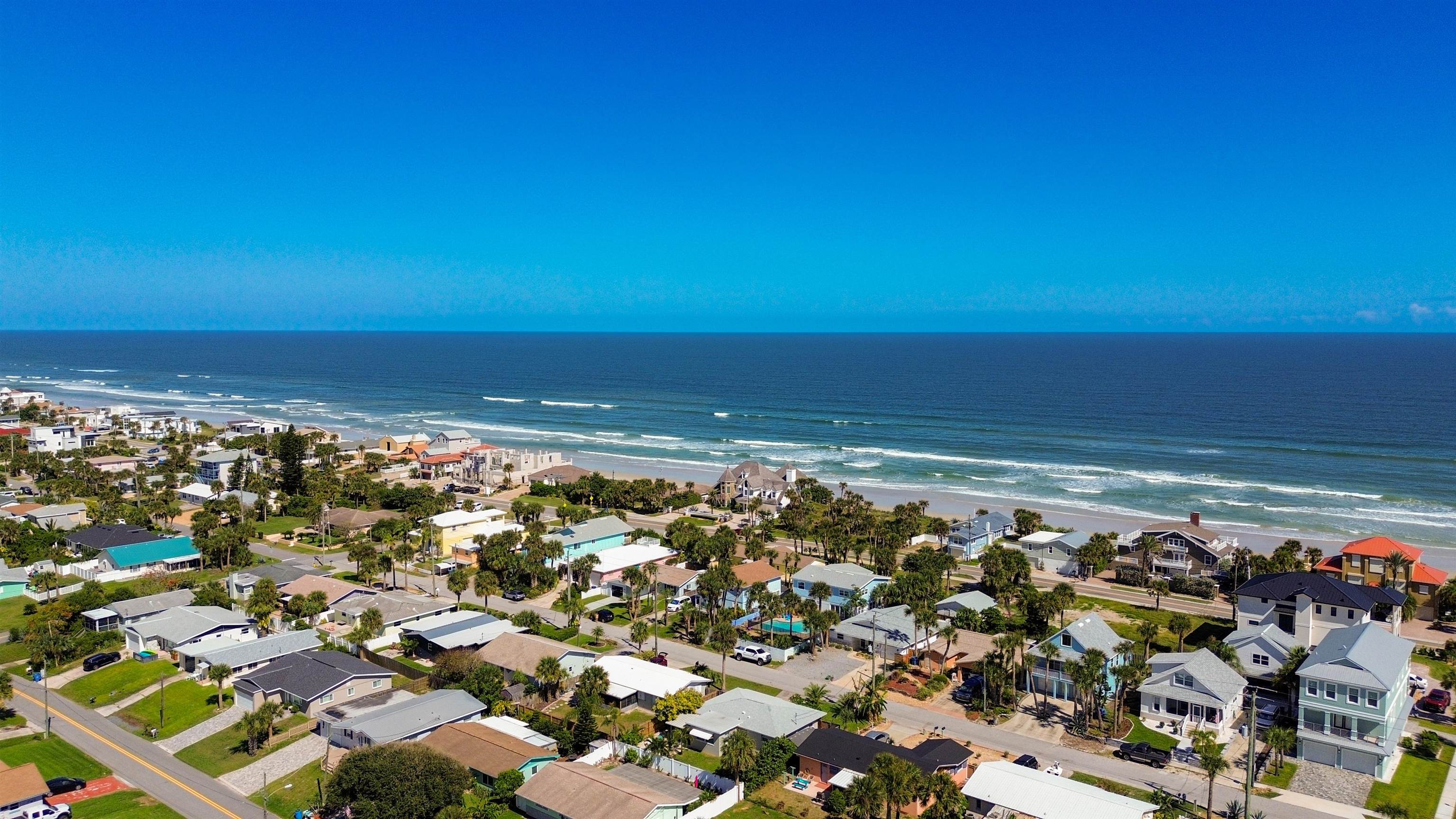 4736 South Atlantic Avenue Ponce Inlet, FL 32127 - Photo 9 of 32 Aerial overview of property's location featuring expansive beach and nearby suburban area