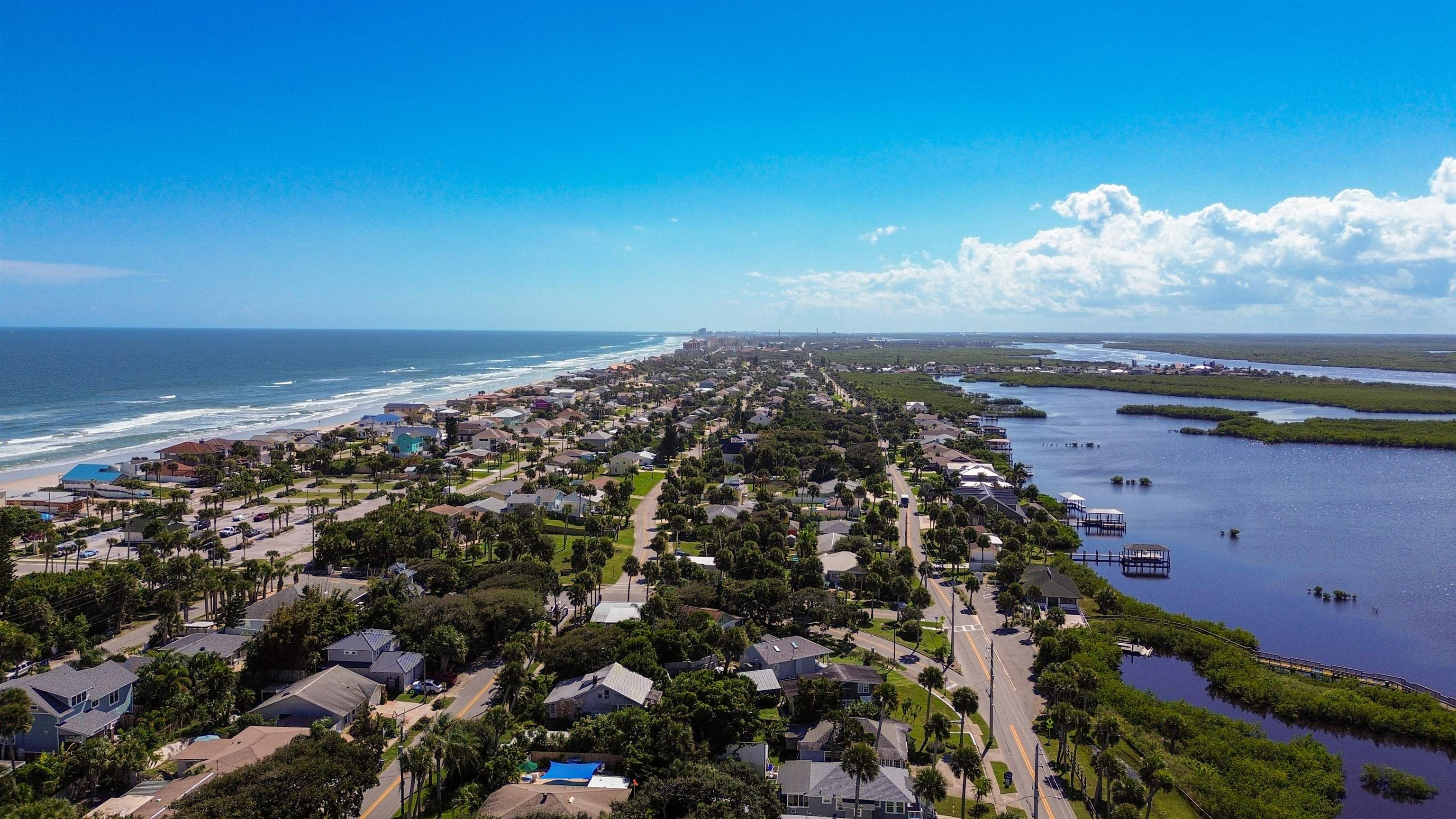 4736 South Atlantic Avenue Ponce Inlet, FL 32127 - Photo 7 of 32 Aerial perspective of suburban area featuring a nearby body of water