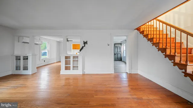 a view of an entryway with wooden floor
