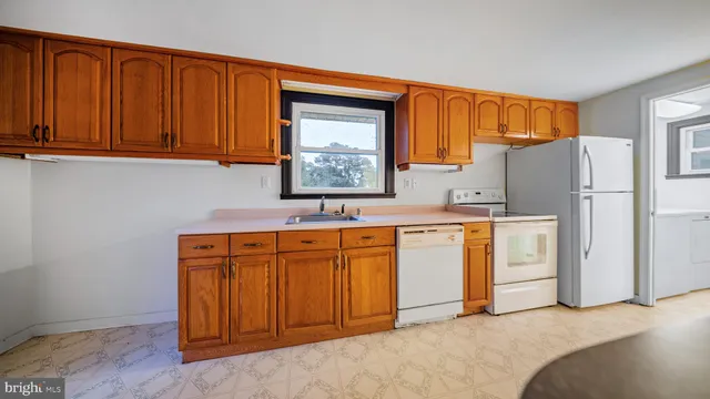 a spacious bathroom with a sink and a mirror