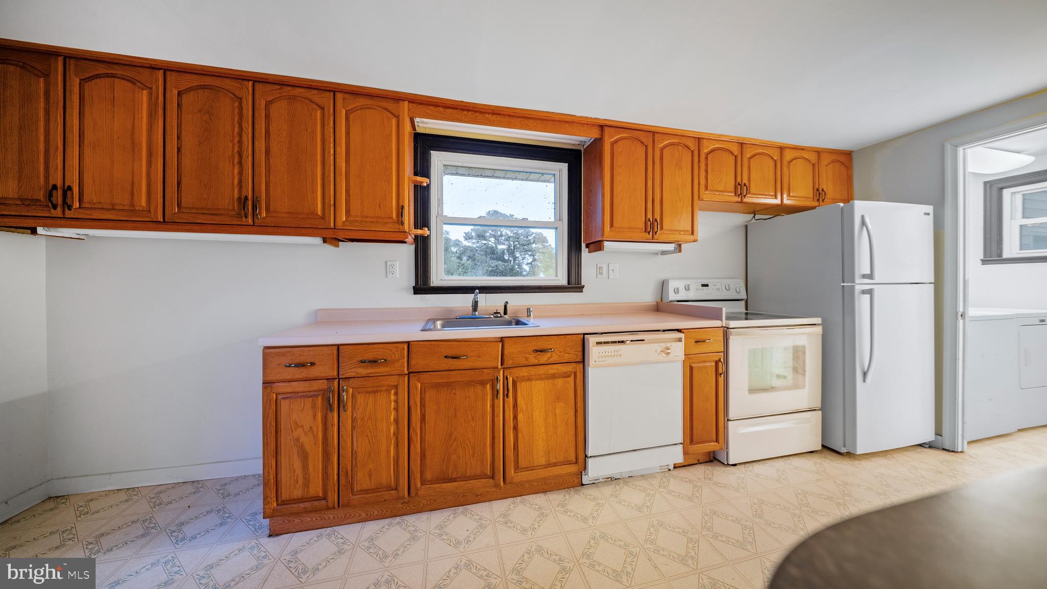 2539 Old House Point Road Fishing Creek, MD 21634 - Photo 13 of 33 a spacious bathroom with a sink and a mirror