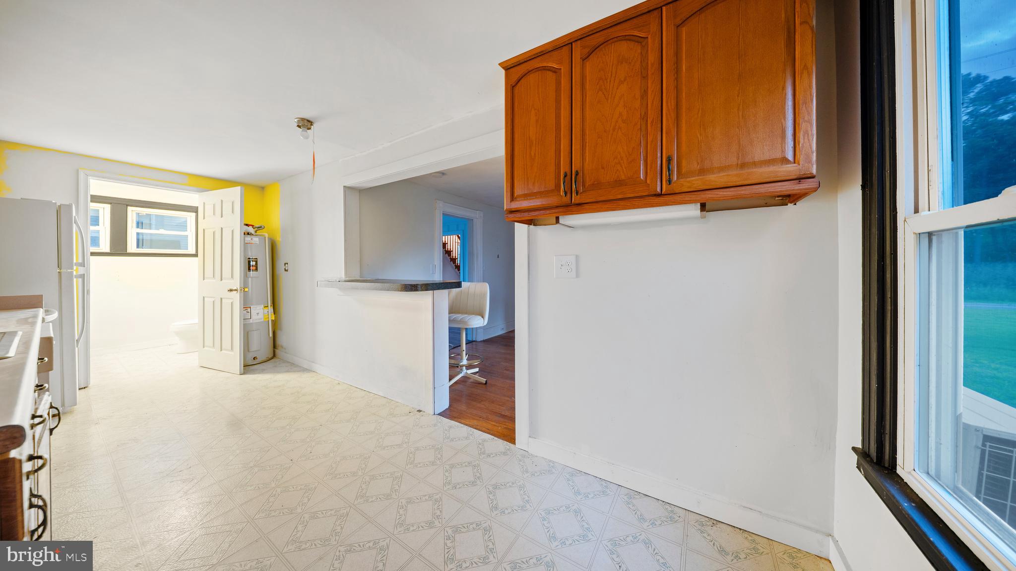 2539 Old House Point Road Fishing Creek, MD 21634 - Photo 14 of 33 a view of a kitchen with wooden floor and cabinets