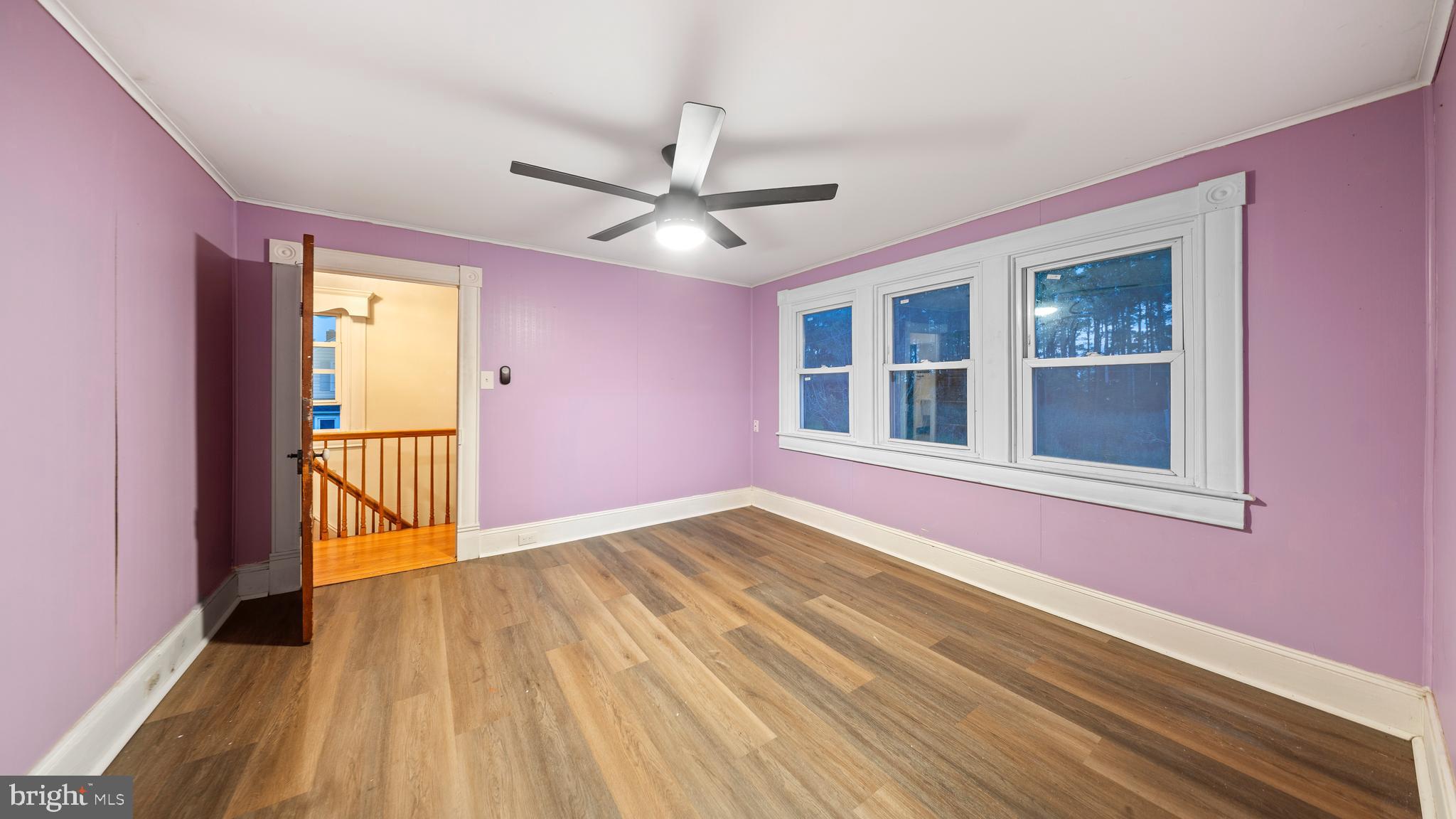 2539 Old House Point Road Fishing Creek, MD 21634 - Photo 19 of 33 a view of an empty room with a window and wooden floor