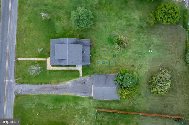 a view of an house with backyard space and garden