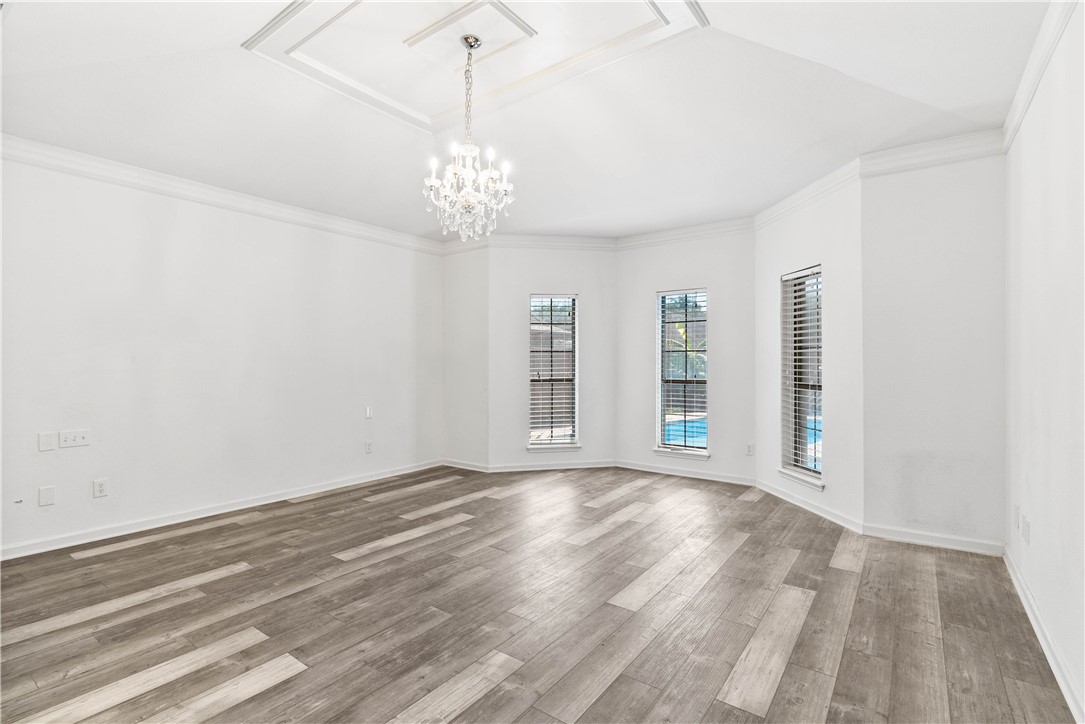 7009 Bevington Drive Corpus Christi, TX 78413 - Photo 15 of 34 wooden floor in an empty room with a window