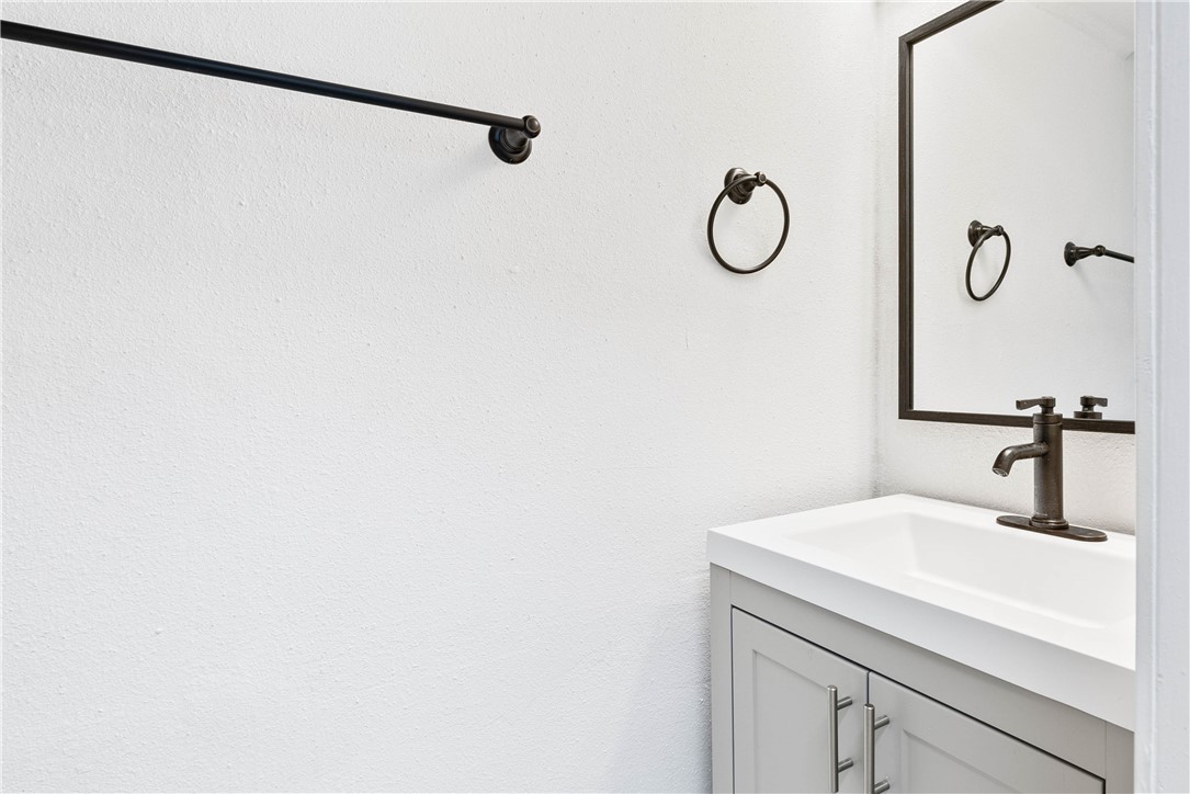 7009 Bevington Drive Corpus Christi, TX 78413 - Photo 4 of 34 a bathroom with a shower and vanity