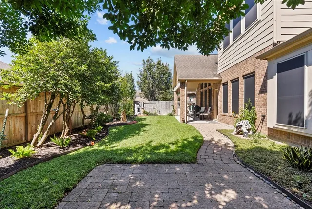 a view of a garden with a large tree
