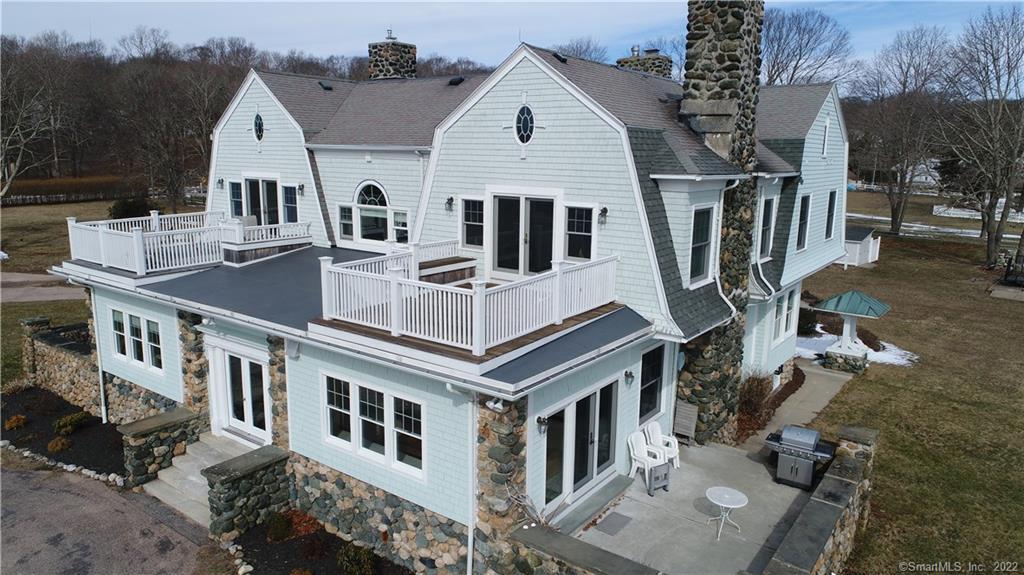 20 Cove Road, Unit 3 Stonington, CT 06378 - Photo 1 of 1 Elegant Edgemere Manor showing deck for Unit #3 with views to the east over the cove and south to Fisher's Island Sound