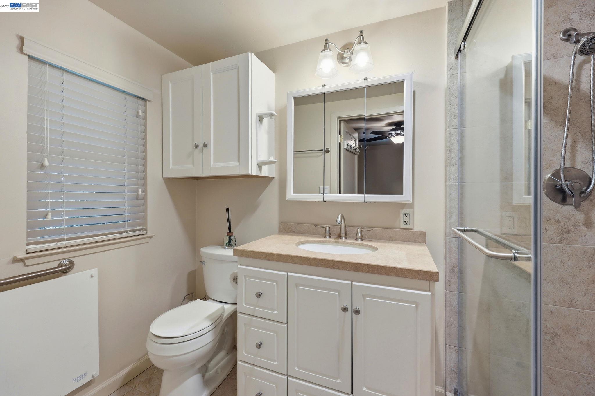 11700 Oak Road Forestville, CA 95436 - Photo 12 of 20 a bathroom with a granite countertop sink toilet and shower