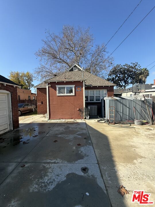 1218 North Spring Avenue Compton, CA 90221 - Photo 15 of 16 a front view of a house with a yard