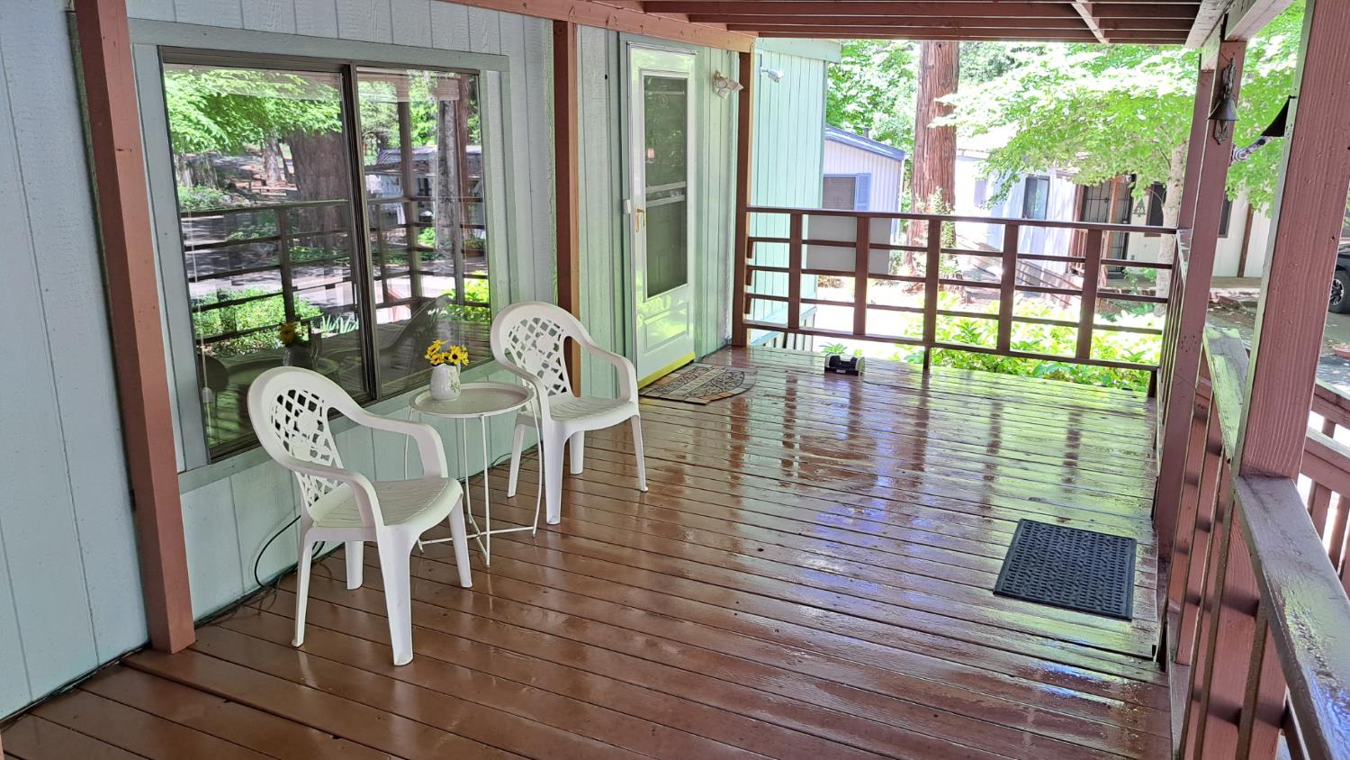 5766 Pony Express Trail, Unit 4 Pollock Pines, CA 95726 - Photo 4 of 17 a dining room with wooden floor a glass table and chairs