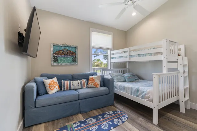 a reading room with furniture and wooden floor