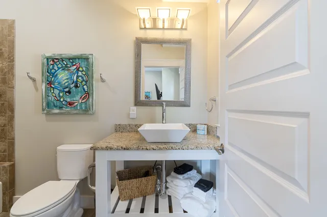 a view of a patio with a table chairs and a bed