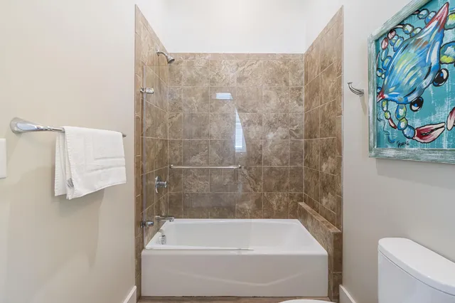 a view of a patio with a table and chairs and couches