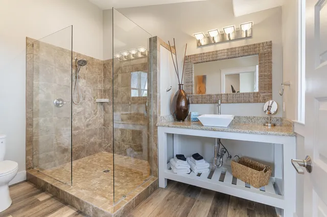 an aerial view of a house with a ocean view