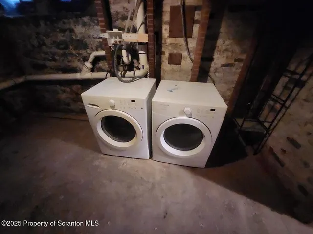 a view of a refrigerator in kitchen and wooden floor
