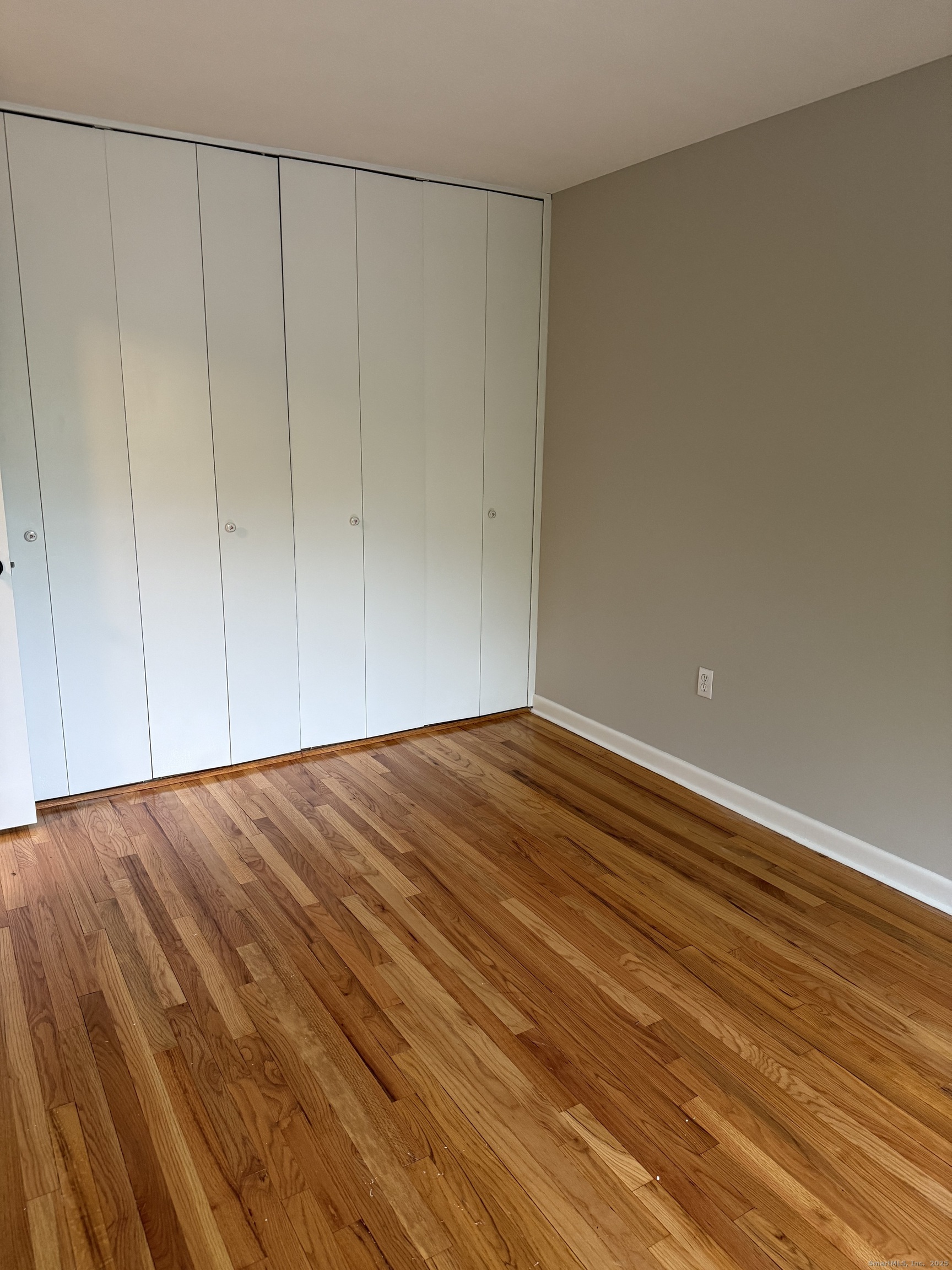 240 Centerbrook Road, Unit 240 Hamden, CT 06518 - Photo 12 of 26 a view of empty room with wooden floor