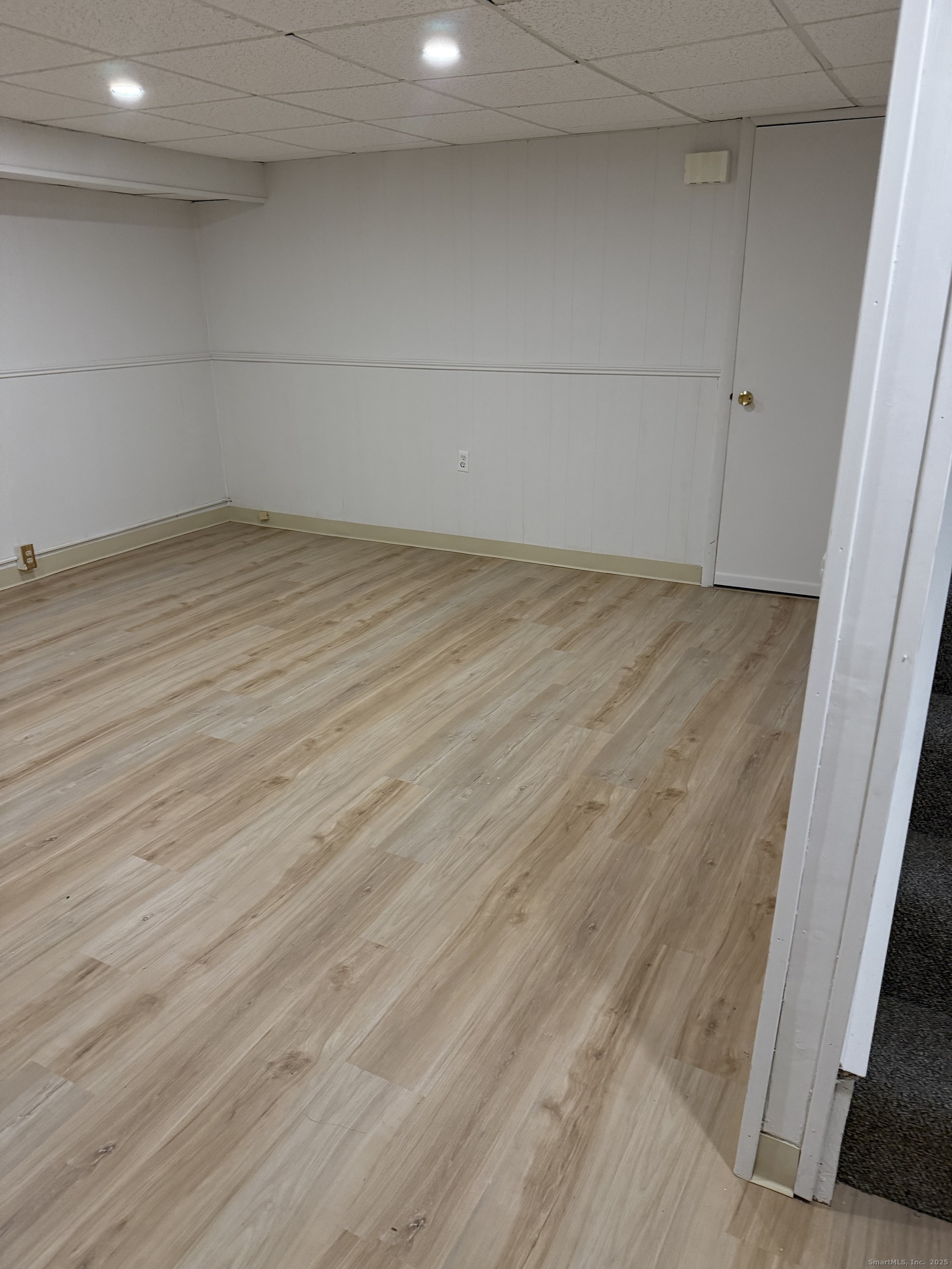 240 Centerbrook Road, Unit 240 Hamden, CT 06518 - Photo 22 of 26 a view of an empty room with wooden floor