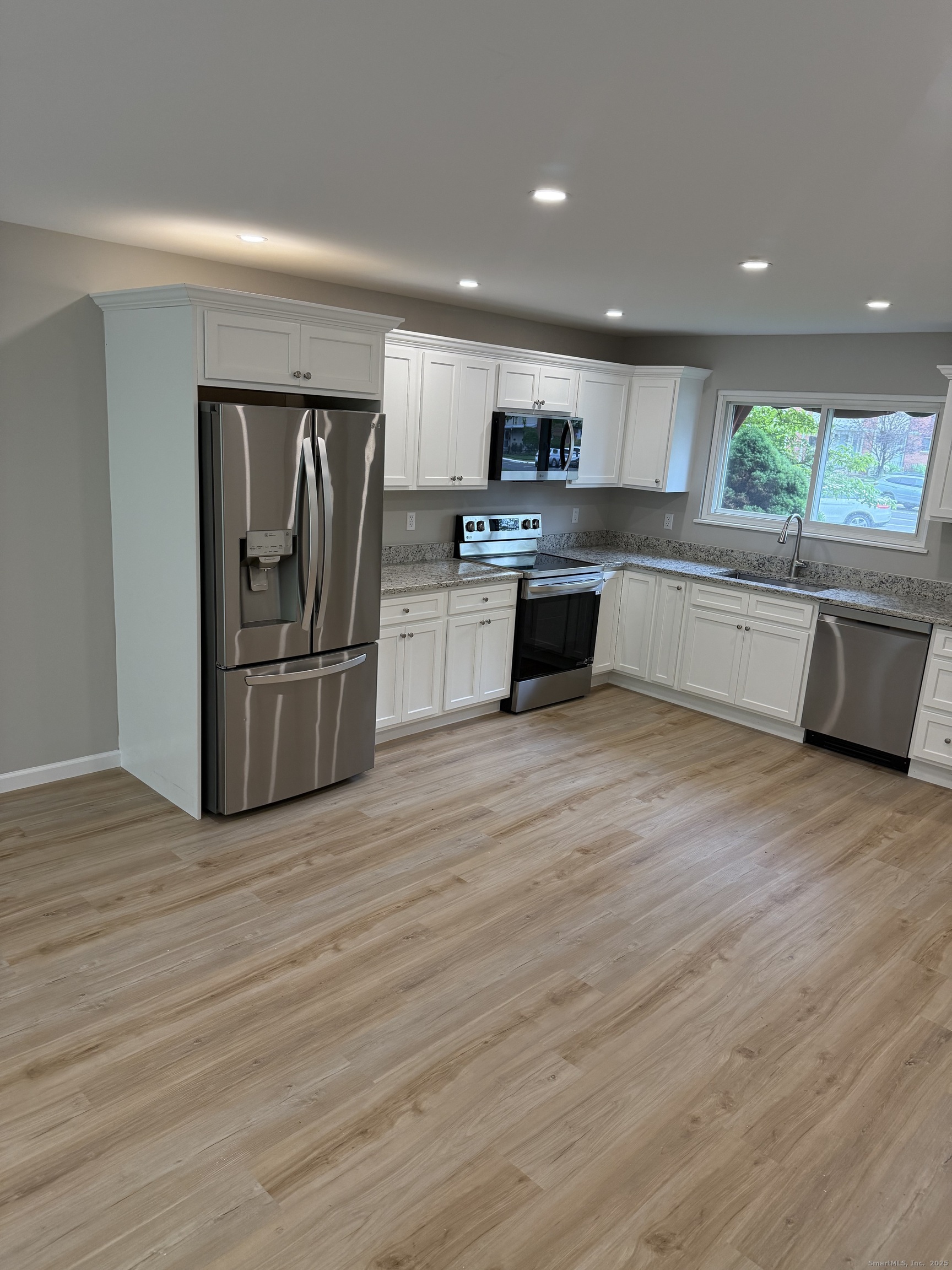 240 Centerbrook Road, Unit 240 Hamden, CT 06518 - Photo 5 of 26 a large kitchen with stainless steel appliances granite countertop a refrigerator and a stove