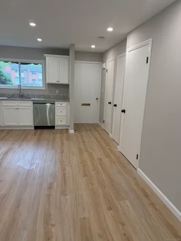 a kitchen with stainless steel appliances a refrigerator sink and cabinets