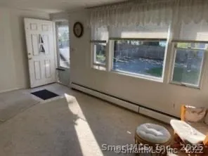 a view of a livingroom with furniture and window