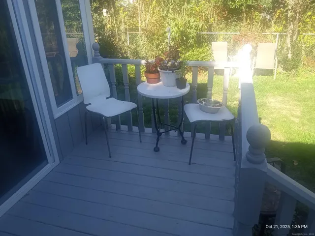 a view of a chairs and table in patio