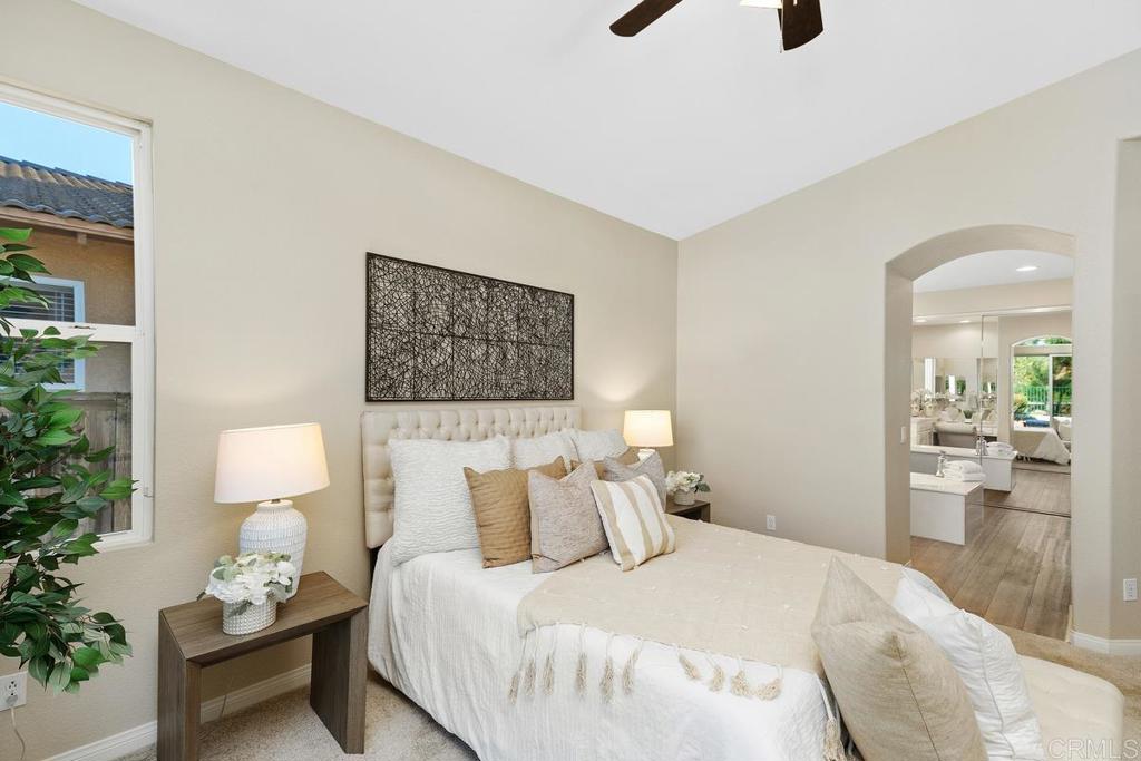 46056 Paseo Gallante Temecula, CA 92592 - Photo 16 of 41 a bedroom with a bed and a couch