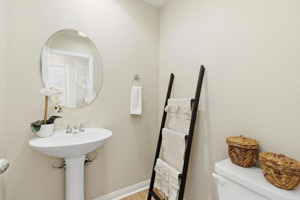 46056 Paseo Gallante Temecula, CA 92592 - Photo 21 of 41 a bathroom with a sink and a mirror