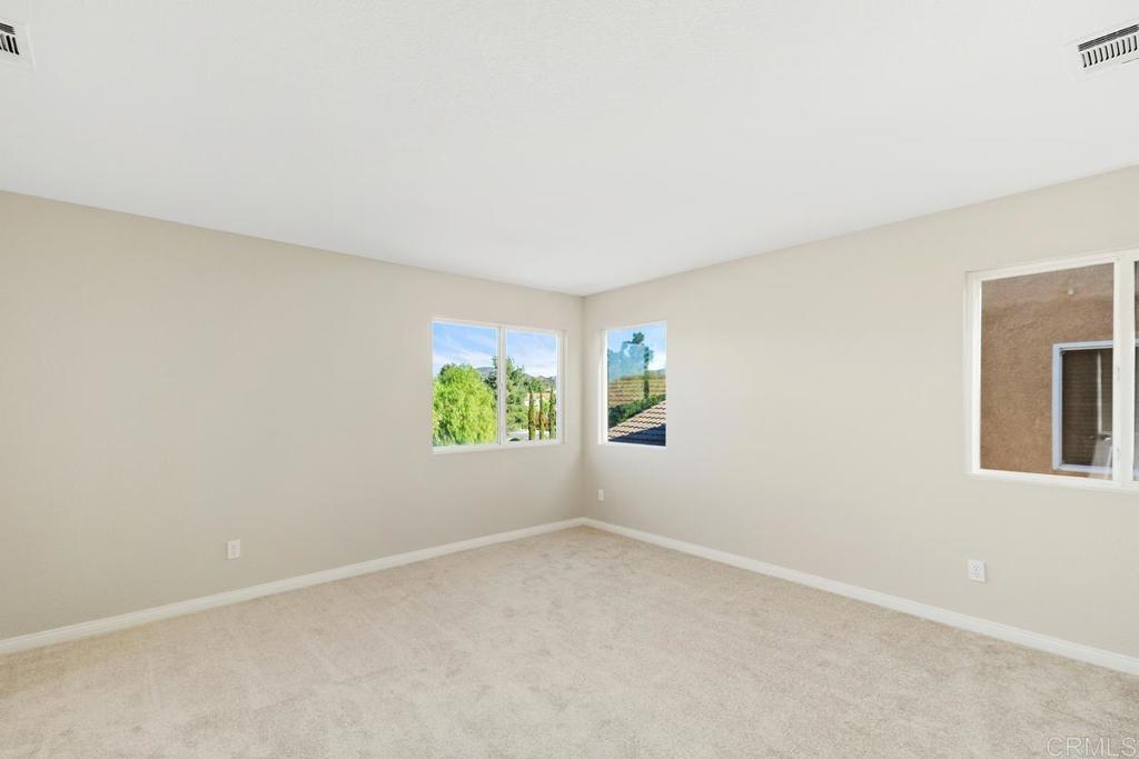 46056 Paseo Gallante Temecula, CA 92592 - Photo 27 of 41 an empty room with windows