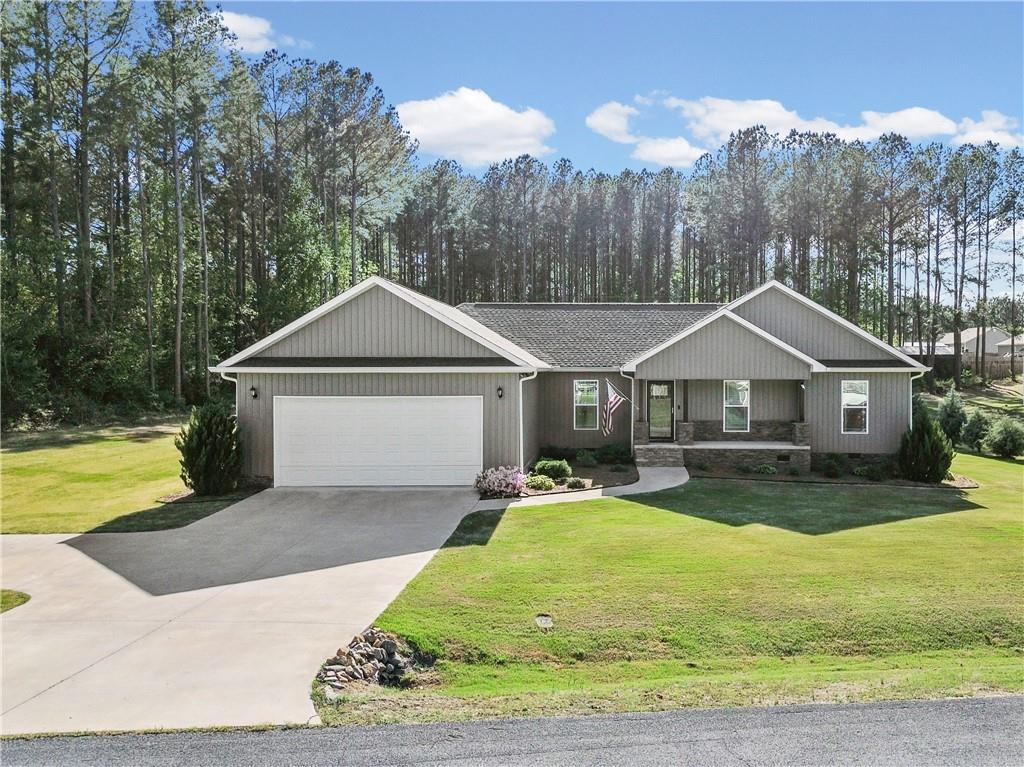 611 Bell Loop Chatsworth, GA 30705 - Photo 3 of 42 a front view of a house with yard and green space