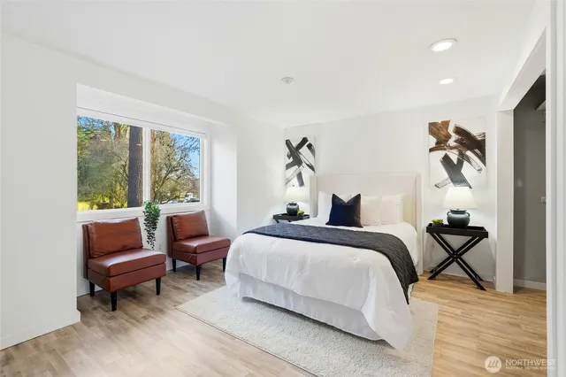 a bedroom with a bed and a couch