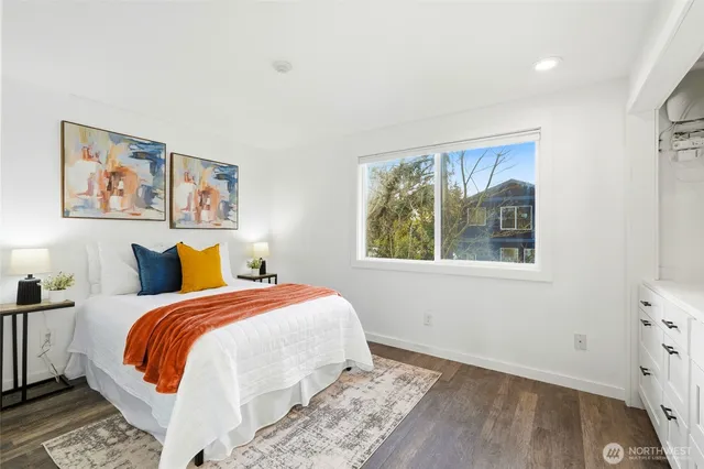 a bed room with a bed and a window