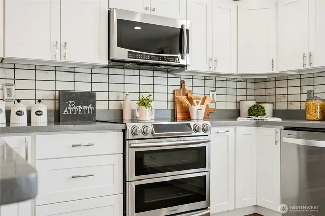 a kitchen with appliances and cabinets