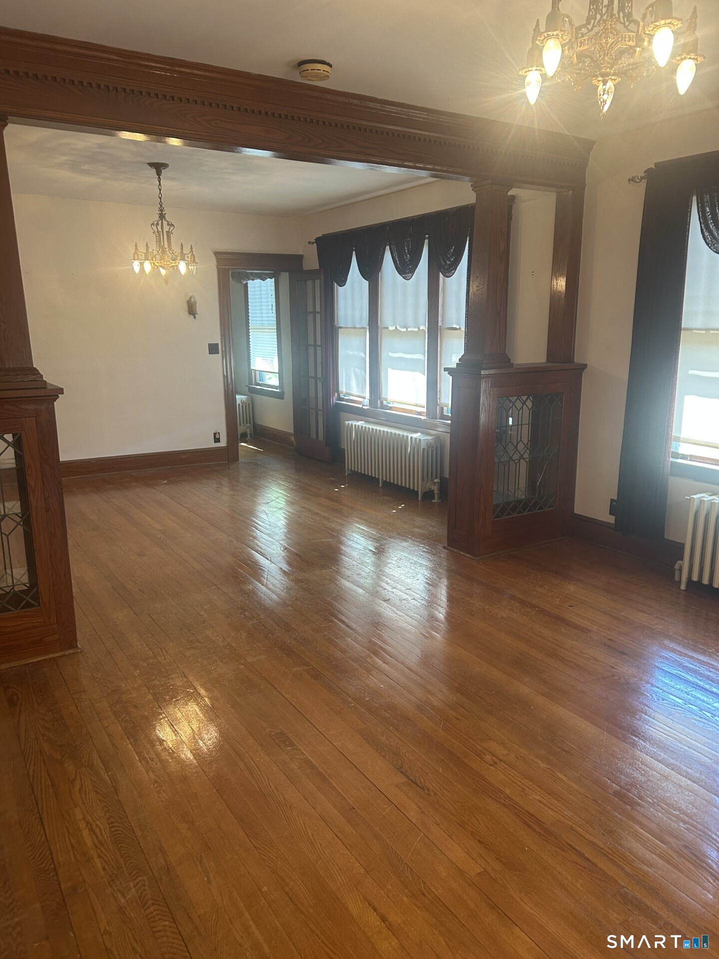 41 Lawlor Street Waterbury, CT 06708 - Photo 6 of 12 Combination Living and Dining Room, plus hardwood floors