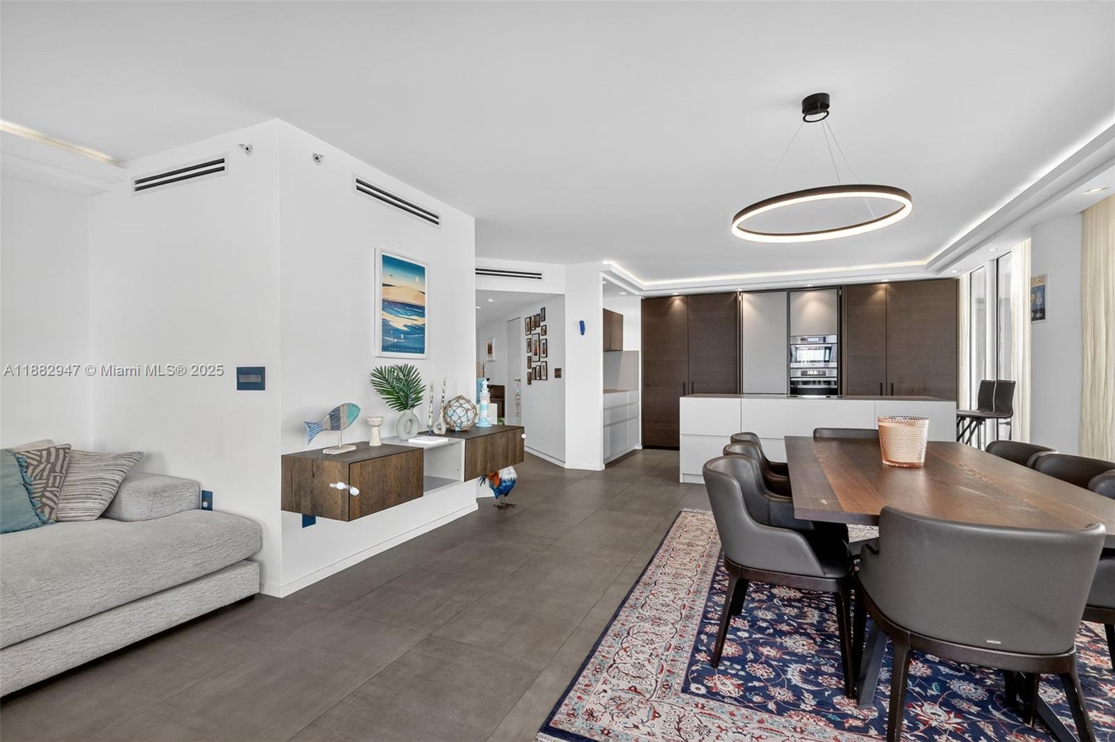 3000 Island Boulevard, Unit 906 Aventura, FL 33160 - Photo 18 of 58 a living room with furniture and a large window