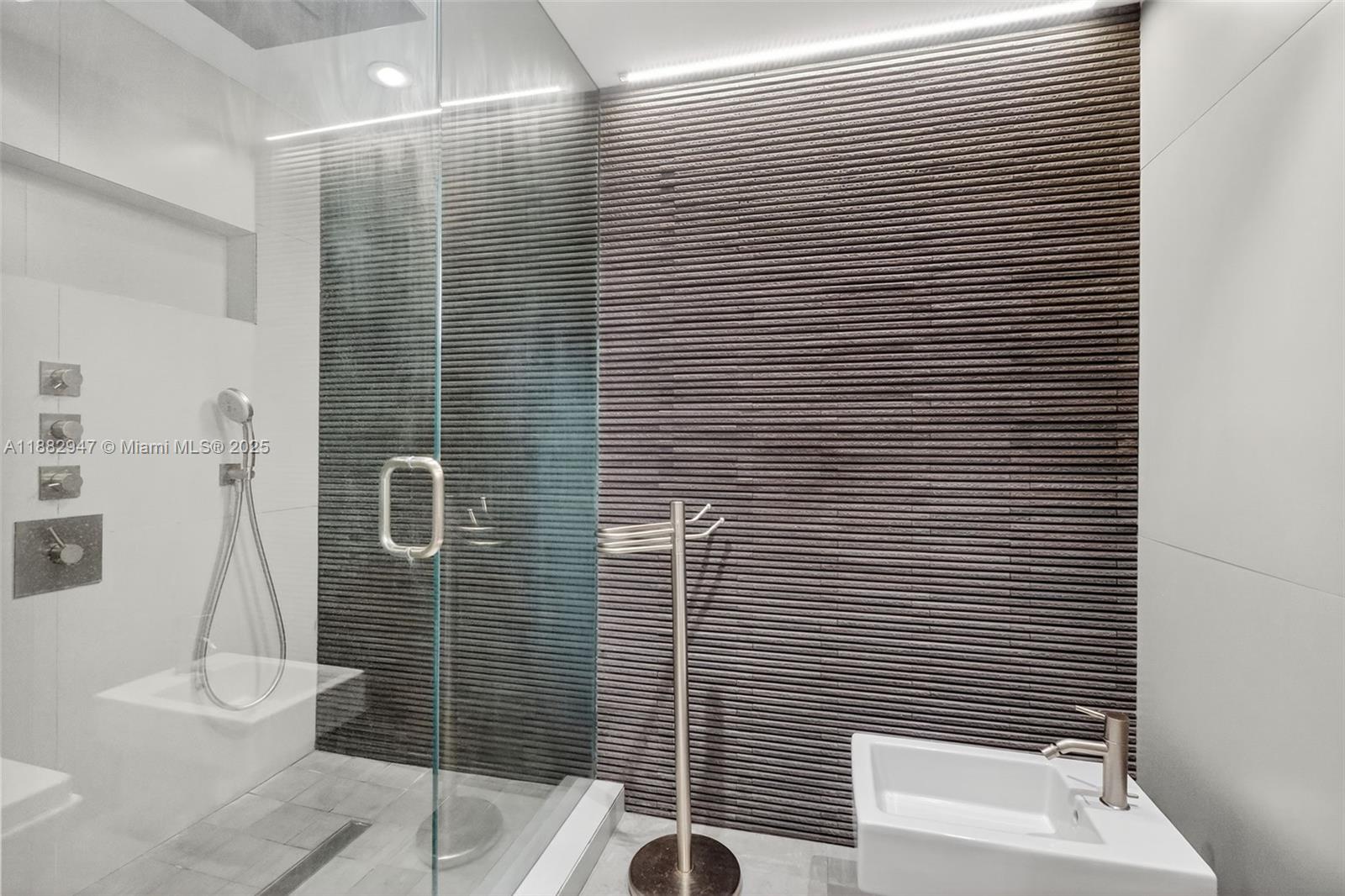 3000 Island Boulevard, Unit 906 Aventura, FL 33160 - Photo 32 of 58 a bathroom with a toilet and a shower