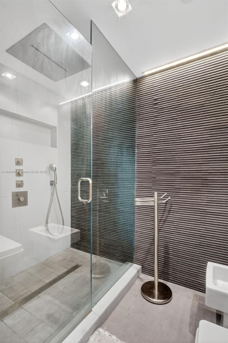 3000 Island Boulevard, Unit 906 Aventura, FL 33160 - Photo 33 of 58 a bathroom with a shower