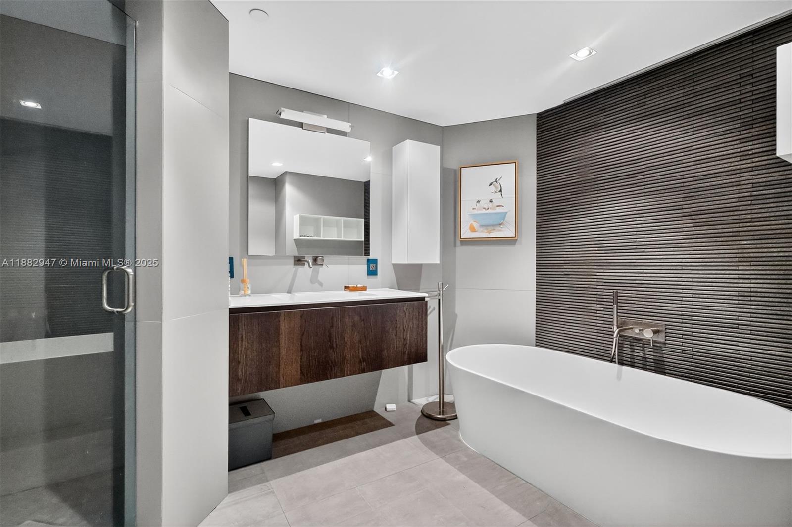 3000 Island Boulevard, Unit 906 Aventura, FL 33160 - Photo 35 of 58 a bathroom with a sink a toilet and shower