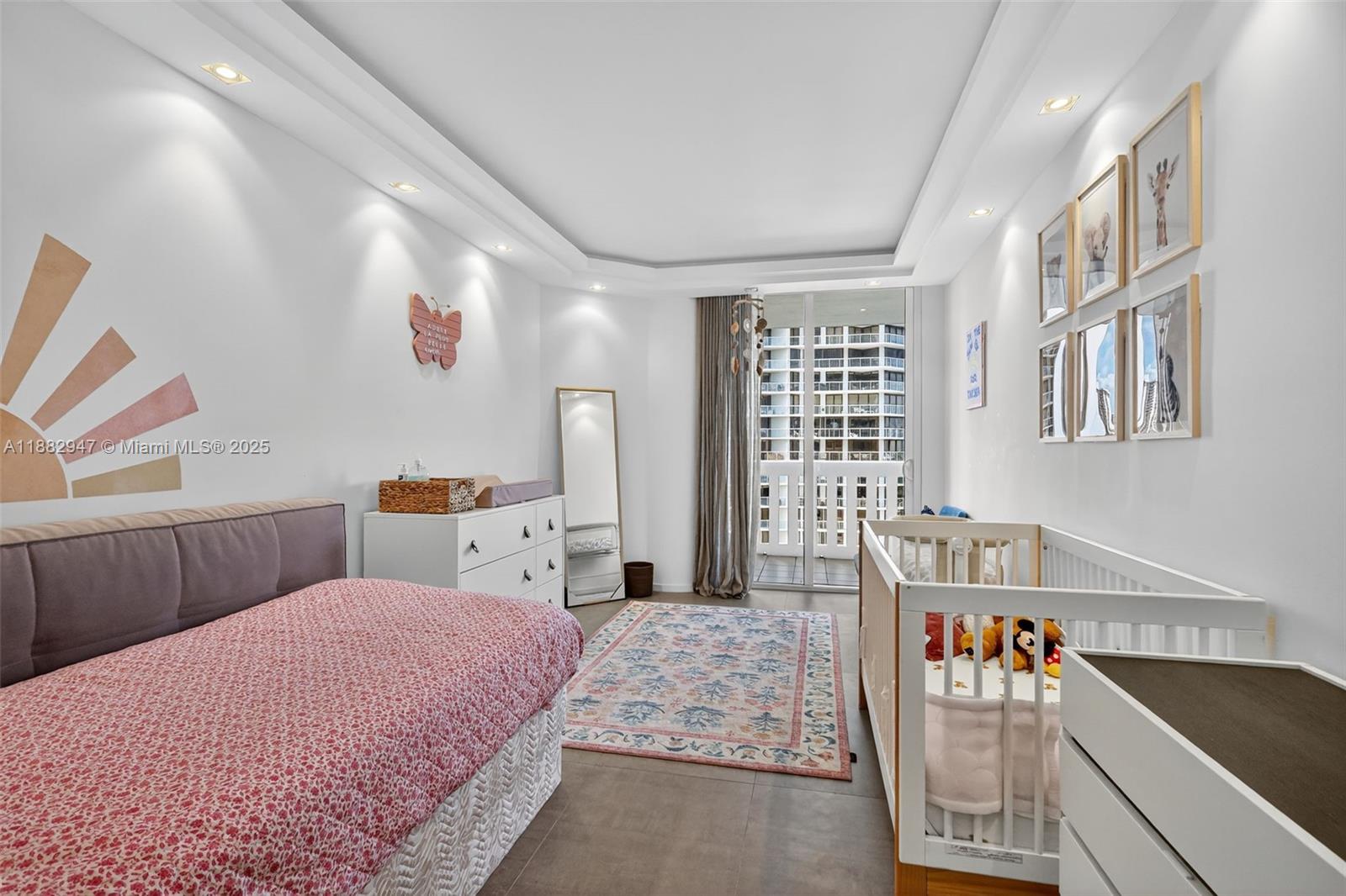 3000 Island Boulevard, Unit 906 Aventura, FL 33160 - Photo 39 of 58 a bedroom with a bed and a table