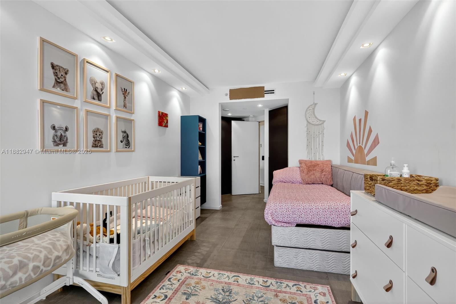 3000 Island Boulevard, Unit 906 Aventura, FL 33160 - Photo 40 of 58 a living room with furniture and baby crib